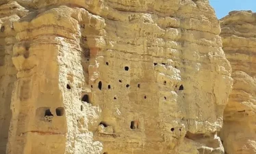 Ancient sky caves carved into sandstone cliffs in Upper Mustang near Lo Manthang, Nepal